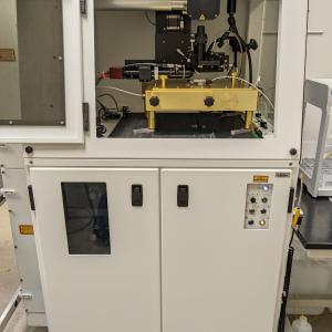 Applied Spectra Inc, RESOlution-SE 193nm Laser Ablation Accessory. Large white steel cabinet with optics inside.