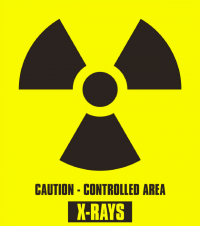 Xray warning symbol, with "Caution - Controlled Area X-Rays" below